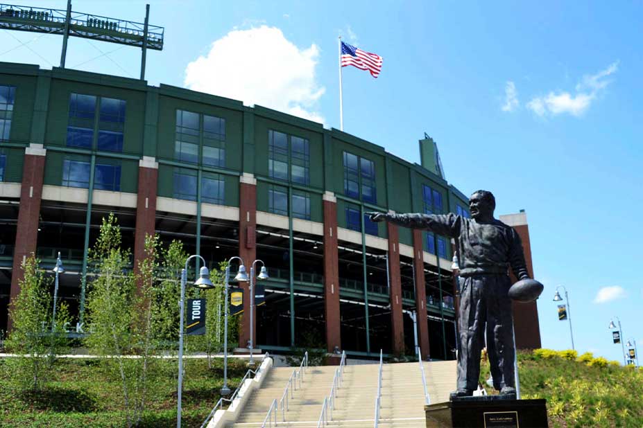 Lambeau Field with statue of Curley Lambeau in bronz in front